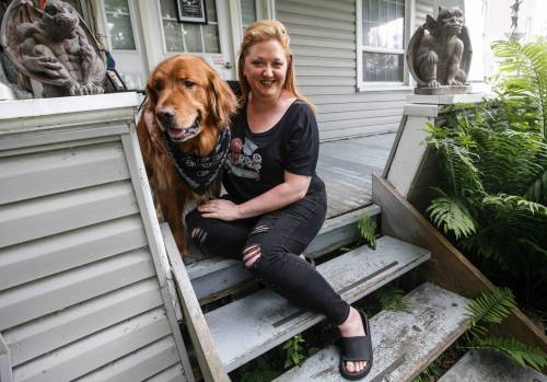 Theresa Thomson (with dog Ragnar Lothpup) is a performer and director who has billeted fringe performers for the past 20 years, including Paco Erhard. (John Woods / Free Press)