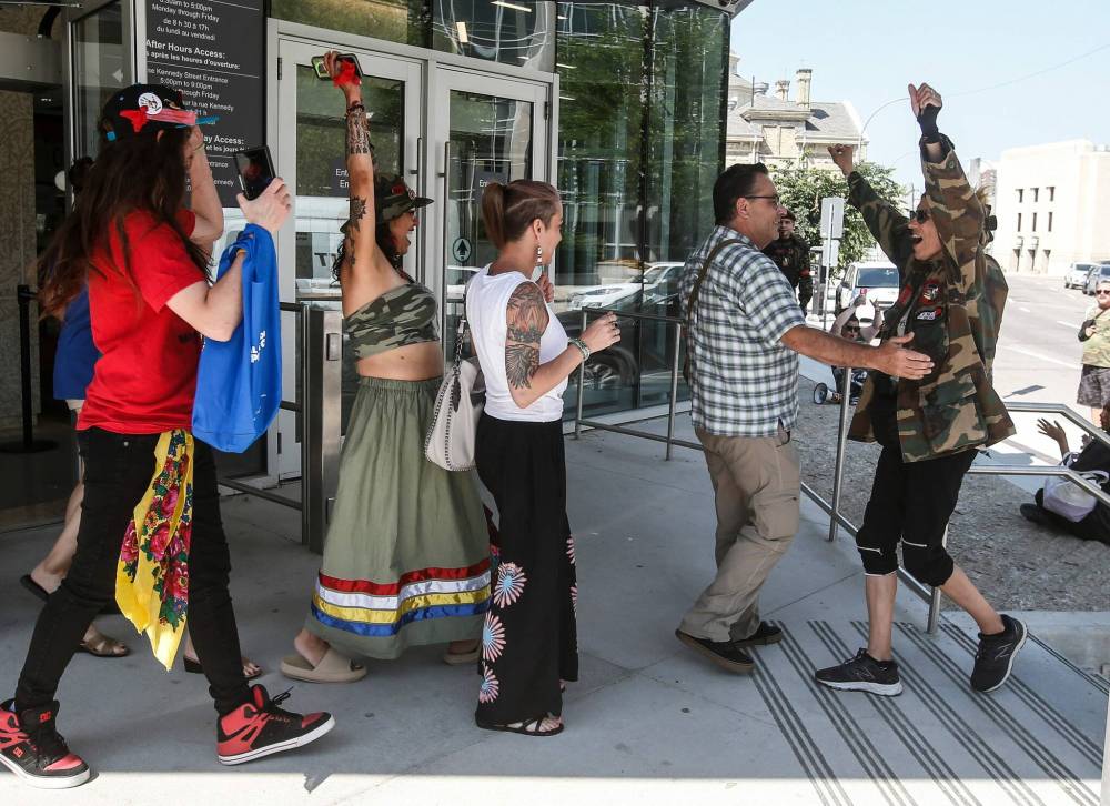 JOHN WOODS / THE CANADIAN PRESS
Families and supporters of four murdered women celebrate outside the Manitoba Law Courts after the guilty verdict of serial killer Jeremy Skibicki was delivered Thursday.