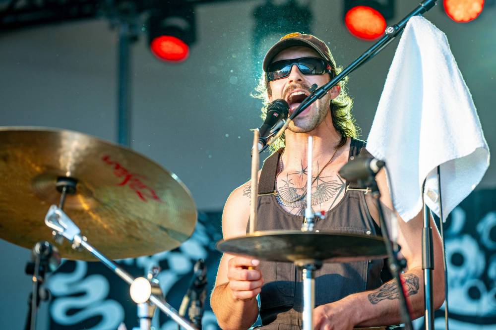 NIC ADAM / FREE PRESS
Local artist Roman Clarke performs at Winnipeg Folk Festival’s Big Bluestem stage Thursday evening.