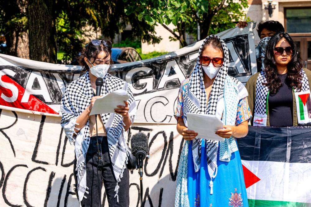 NIC ADAM / FREE PRESS
Zara (left), a representative of the U of M encampment for Palestine leadership, speaks at a press conference on Monday to discuss the impending legal action and statement issued ordering their departure from the University of Manitoba.
