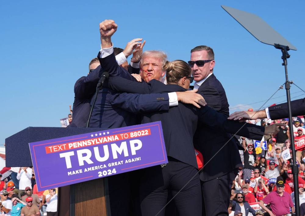Jabin Botsford / Washington Post Files
Former U.S. president Donald Trump raises his arm with blood on his face after being shot at during a rally Saturday.