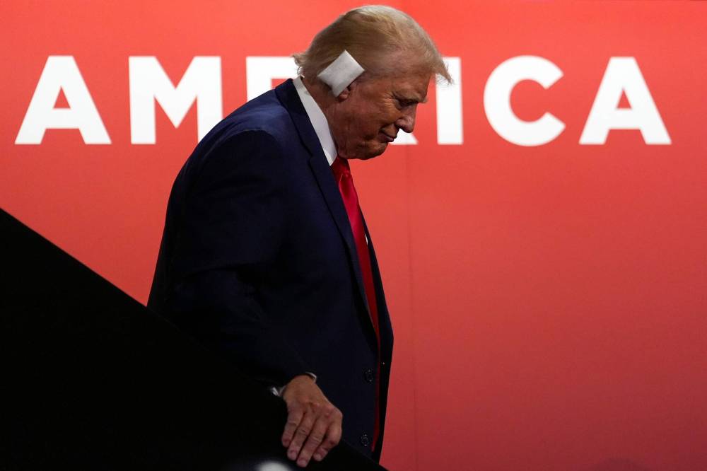 Carolyn Kaster / the associated press files
Republican presidential candidate former president Donald Trump walks down stairs on Monday, the first day of the Republican National Convention, in Milwaukee.