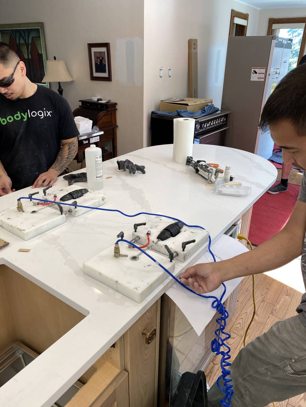 The ‘seam-setter’ is a tool that uses suction to ‘grab’ the tops of two pieces of quartz, allowing proper alignment during the adhesion process. (Marc LaBossiere / Free Press)