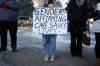 A person holds a sign at a rally organized by Mandy Swidersky, a gender and woman studies student at Brandon University, in March 2023. (Tim Smith / Brandon Sun files)