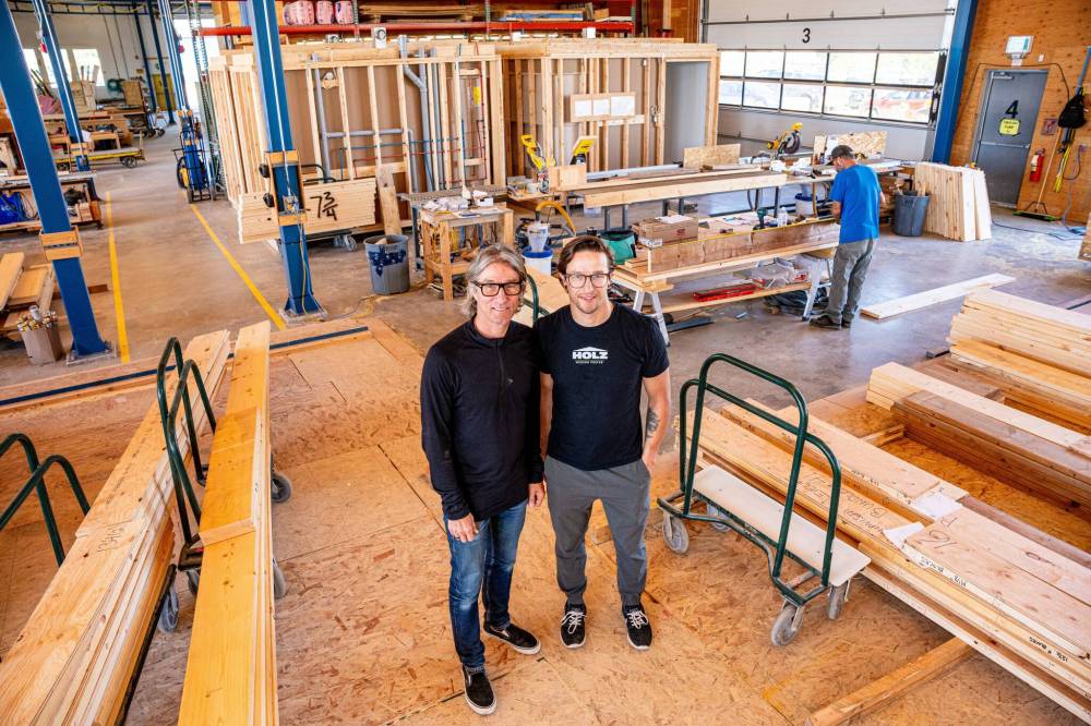 NIC ADAM / FREE PRESS
Ted Geddert (left), founder and president of Holz, in the workshop of his business with his son and general manager Aaron Geddert.