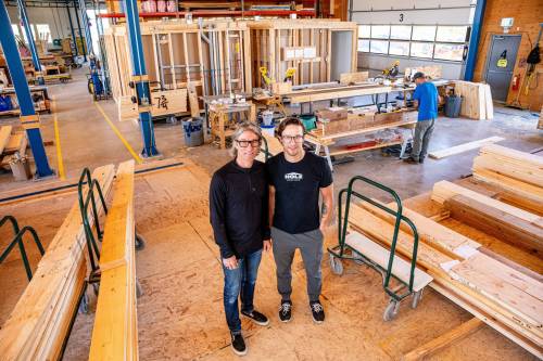 NIC ADAM / FREE PRESS
                                Ted Geddert (left), founder and president of Holz, in the workshop of his business with his son and general manager Aaron Geddert.