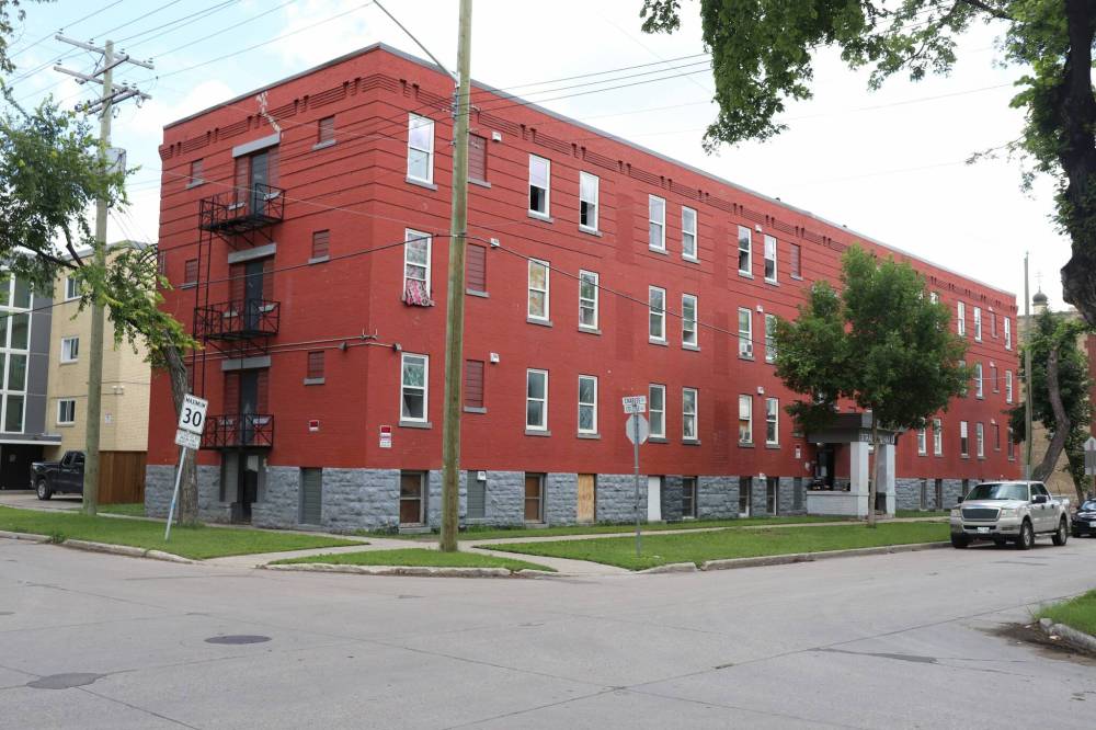 TYLER SEARLE / FREE PRESS
An emergency shelter was set up in hotel rooms for tenants of 285 College Ave., pictured, who had nowhere else to go when they were evicted.