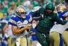 Blue Bombers quarterback Zach Collaros (8) runs the football during the first half of CFL football action against Saskatchewan Roughriders in Regina, on Friday. (Heywood Yu / The Canadian Press)
