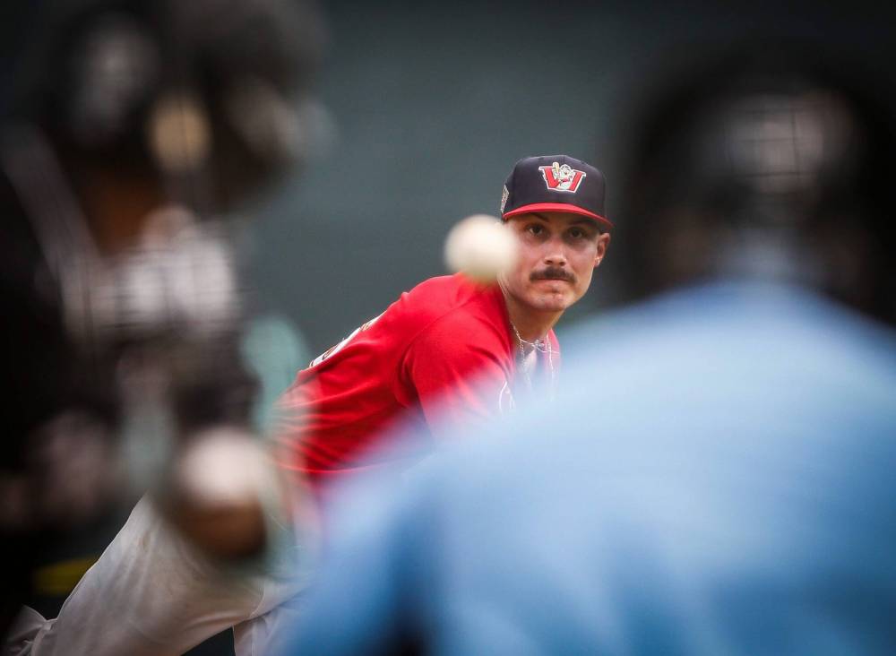 Winnipeg Goldeyes’ Joey Matulovich (16) pitches against the Milwaukee Milkmen in Winnipeg on Sunday. (John Woods / Free Press)