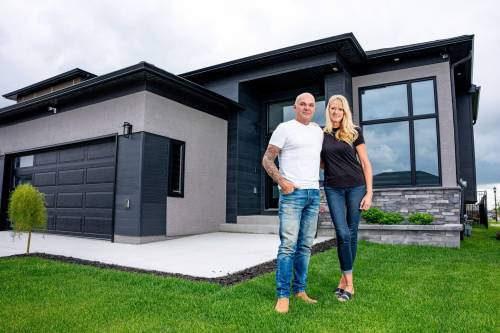 NIC ADAM / FREE PRESS
                                Sage Creek residents Marc (left) and Tammy Gagnon pictured outside their house Tuesday. Residents in Sage Creek say they are tired of crime in the area and are now exploring the formation of a community patrol group.