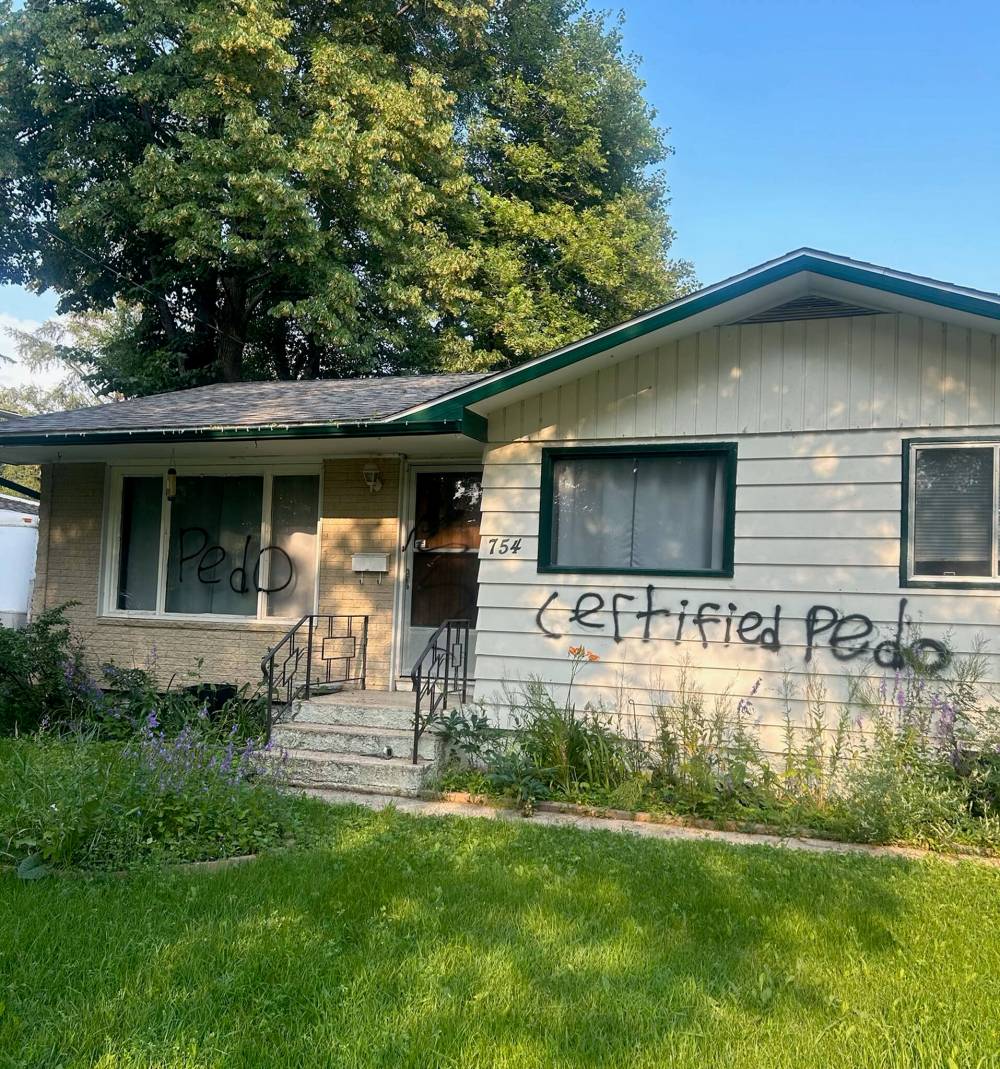 SUPPLIED
The front of Scott Taylor’s house was spray-painted after his arrest.