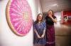 MIKAELA MACKENZIE / FREE PRESS FILES
                                Artist Lita Fontaine (left) and assistant curator Marie-Anne Redhead with Warm Heart Wheel: My Medicine Series.
