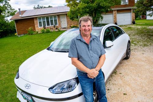 NIC ADAM / FREE PRESS Kent Heinrich pictured alongside his 2024 Hyundai Ioniq 6 on Wednesday afternoon. 240717 - Wednesday, July 17, 2024. Reporter: ?
                                NIC ADAM / FREE PRESS
                                Kent Heinrich, with his battery-powered Hyundai Ioniq 6, is on a mission is to spread the word about the benefits of electric vehicle adoption &mdash; even in more remote communities.