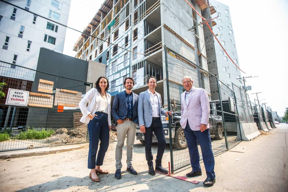 MIKAELA MACKENZIE / FREE PRESS
Sarah Anderson, director of talent management (left), Dan Bockstael, co-president, Nick Bockstael, co-president, and Carmine Militano, CEO, visit a construction site on Colony Street.