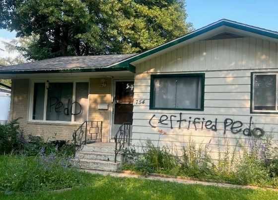 The front of Scott Taylor’s house was spray-painted after his arrest. (Supplied)