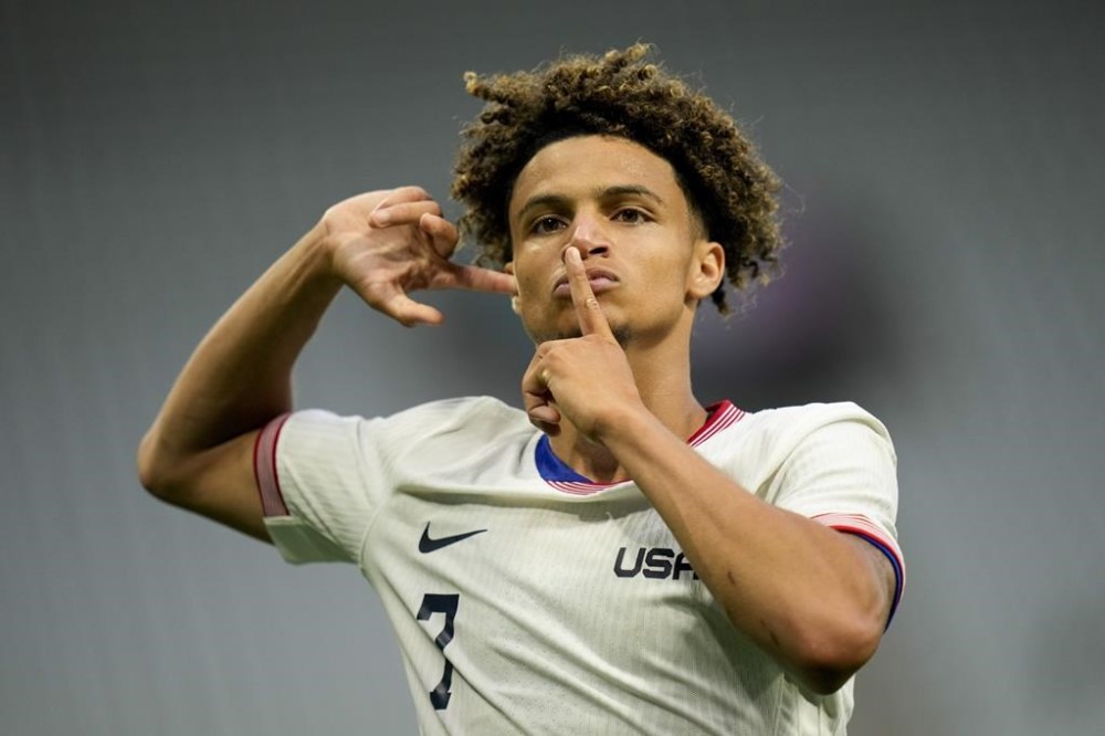 United States' Kevin Paredes celebrates scoring his side's 3rd goal during the men's Group A soccer match between the United States and Guinea, at Geoffroy-Guichard Stadium, during the 2024 Summer Olympics, Tuesday, July 30, 2024, in Saint-Etienne, France. (AP Photo/Silvia Izquierdo)