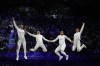 Italy's Alberta Santuccio, second right, celebrates with her teammates Rossella Fiamingo, second left, Giulia Rizzi, left, and Mara Navarria after winning the women's team Epee final match against France during the 2024 Summer Olympics at the Grand Palais, Tuesday, July 30, 2024, in Paris, France. (AP Photo/Andrew Medichini)
