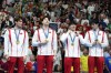 China's Xu Jiayu, Qin Haiyang, Sun Jiajun, and Pan Zhanle pose for a photo with their gold medals on the podium for the men's 4x100-meter medley relay at the Summer Olympics in Nanterre, France, Sunday, Aug. 4, 2024. (AP Photo/Natacha Pisarenko)