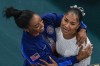 Jordan Chiles, of the United States, and Simone Biles, of the United States, celebrate after the women's artistic gymnastics individual floor finals in Bercy Arena at the 2024 Summer Olympics, Monday, Aug. 5, 2024, in Paris, France. Biles won the silver medal and Chiles the bronze medal. (AP Photo/Morry Gash)