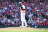St. Louis Cardinals relief pitcher Shawn Armstrong pauses on the mound after giving up a solo home run to New York Mets' Jeff McNeil, back right, during the sixth inning of a baseball game Monday, Aug. 5, 2024, in St. Louis. (AP Photo/Scott Kane)