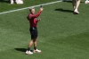 Coach Bev Priestman of Canada takes photos on the pitch at Geoffroy-Guichard Stadium ahead of the 2024 Summer Olympics, Tuesday, July 23, 2024. Opinions are divided on the punishment meted out to the Canadian women’s soccer team over its drone spying scandal, according to a new poll. THE CANADIAN PRESS/AP-Silvia Izquierdo