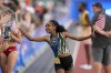 FILE - Weini Kelati celebrates after winning the women's 10,000-meter final during the U.S. Track and Field Olympic Team Trials, June 29, 2024, in Eugene, Ore. (AP Photo/Charlie Neibergall, File)