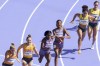 Germany, the United States, and Australia compete in a women's 4 x 100 meters relay round 1 heat at the 2024 Summer Olympics, Thursday, Aug. 8, 2024, in Saint-Denis, France. (AP Photo/Martin Meissner)