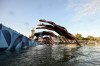 Athletes dive into the Seine River as they take the start of the women's 10km marathon swimming final at the 2024 Summer Olympics in Paris, France, Thursday, Aug. 8, 2024. THE CANADIAN PRESS/Martin Bureau/Pool Photo via AP