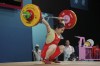 Luo Shifang of China competes during the women's 59kg weightlifting event, at the 2024 Summer Olympics, Thursday, Aug. 8, 2024, in Paris, France. (AP Photo/Kin Cheung)