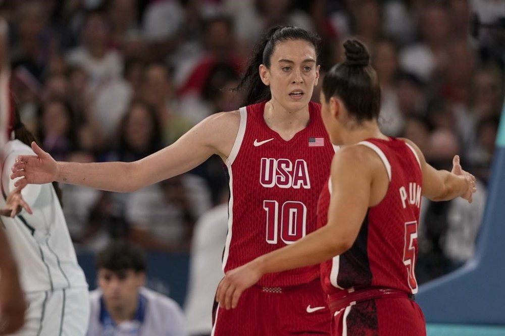 United States' Breanna Stewart (10) celebrates with Kelsey Plum (5) after a basket against Nigeria during a women's quarterfinal game at Bercy Arena at the 2024 Summer Olympics, Wednesday, Aug. 7, 2024, in Paris, France. (AP Photo/Mark J. Terrill)