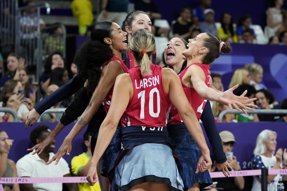 Players for the United States celebrate during a semifinal women's volleyball match against Brazil at the 2024 Summer Olympics, Thursday, Aug. 8, 2024, in Paris, France. (AP Photo/Dolores Ochoa)