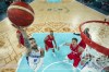 Isaia Cordinier (8), of France shoots past Moritz Wagner (13), of Germany during a men's semifinal game at Bercy Arena at the 2024 Summer Olympics, Thursday, Aug. 8, 2024, in Paris, France. (Gregory Shamus/Pool Photo via AP)