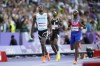 Letsile Tebogo, of Botswana, reacts after winning the gold medal in the men's 200 meters final at the 2024 Summer Olympics, Thursday, Aug. 8, 2024, in Saint-Denis, France. (AP Photo/Ashley Landis)