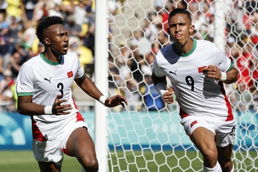 Morocco's Soufiane Rahimi, right, celebrates after scoring a goal during the men's bronze medal soccer match at the 2024 Summer Olympics, Thursday, Aug. 8, 2024, in Nantes, France. (AP Photo/Jeremias Gonzalez)