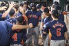 Houston Astros Yordan Alvarez, celebrates in the dugout after hitting a two run home run in the ninth inning of a baseball game against the Texas Rangers, Tuesday, Aug 6, 2024, in Arlington, Texas. (AP Photo/Albert Pena)