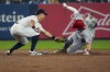 New York Yankees shortstop Anthony Volpe tags out Los Angeles Angels' Mickey Moniak trying to stretch a single into a double during the fifth inning of a baseball game, Thursday, Aug. 8, 2024, in New York. (AP Photo/Bryan Woolston)