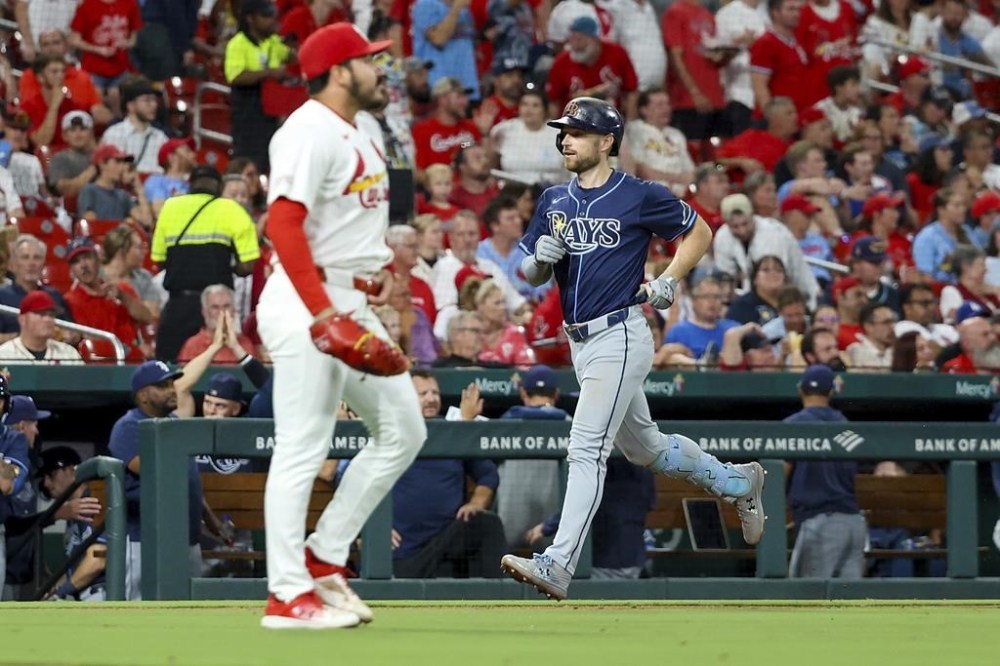 Tampa Bay Rays' Brandon Lowe, right, runs the bases after hitting a two-run home run off St. Louis Cardinals relief pitcher JoJo Romero during the seventh inning of a baseball game Thursday, Aug. 8, 2024, in St. Louis. (AP Photo/Scott Kane)