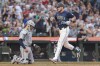 Seattle Mariners' Luke Raley (20) crosses home after hitting a home run as Detroit Tigers catcher Dillon Dingler, left, looks on during the sixth inning of a baseball game, Thursday, Aug. 8, 2024, in Seattle. (AP Photo/Jason Redmond)