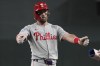Philadelphia Phillies' Bryce Harper reacts after hitting an RBI single against the Arizona Diamondbacks in the sixth inning during a baseball game, Thursday, Aug 8, 2024, in Phoenix. (AP Photo/Rick Scuteri)