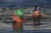 Hungary's Kristof Rasovszky, left, and Germany's Oliver Klemet, right, celebrate after crossing the finish line at the end of the marathon swimming men's 10km competition at the 2024 Summer Olympics, Friday, Aug. 9, 2024, in Paris, France. (AP Photo/Dar Yasin)