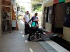 Ndieme Lame, a 57-year-old volunteer for the Paris 2024 Olympic and Paralympic Games navigates a ramp to join a RER train with the help of rail agents, during the 2024 Summer Olympics, Wednesday, Aug. 7 2024, in Paris, France. (AP Photo/Tom Nouvian)