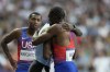 Gold medallist Letsile Tebogo, of Botswana, and bronze medallist Noah Lyles, of the United States, foreground, embrace each other after finishing the men's 200 meters final at the 2024 Summer Olympics, Thursday, Aug. 8, 2024, in Saint-Denis, France. (AP Photo/Ashley Landis)