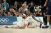 United States' Kevin Durant, right, draws the foul after scoring as United States' Anthony Davis (14) reacts against Serbia during a men's semifinals basketball game at Bercy Arena at the 2024 Summer Olympics, Thursday, Aug. 8, 2024, in Paris, France. (AP Photo/Mark J. Terrill)
