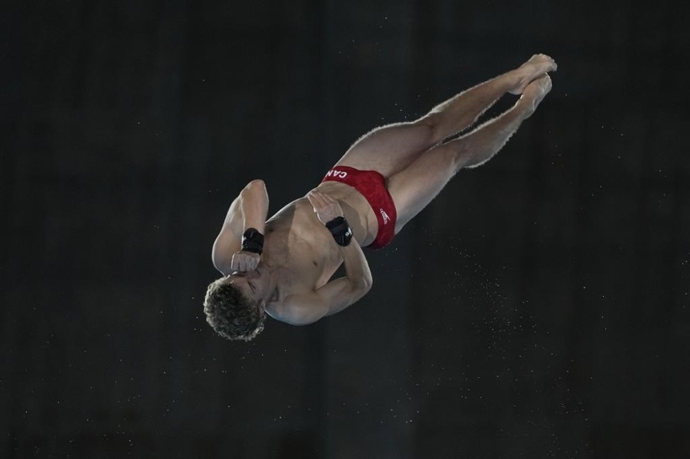 Canada's Rylan Wiens competes in the men's 10m platform diving preliminary, at the 2024 Summer Olympics, Friday, Aug. 9, 2024, in Saint-Denis, France. THE CANADIAN PRESS/AP-Lee Jin-man
