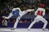 United States' Cj Nickolas competes with Burkina Faso's Faysal Sawadogo in a men's 80kg Taekwondo quarterfinal match during the 2024 Summer Olympics, at the Grand Palais, Friday, Aug. 9, 2024, in Paris, France. (AP Photo/Andrew Medichini)