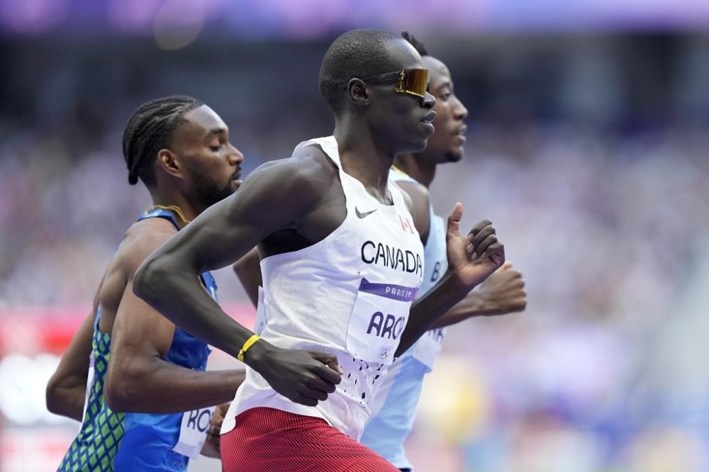 Three track and field finals in the afternoon will feature Canadians, with reigning world champion Marco Arop, of Edmonton, kicking things off in the men's 800-metre final. Arop runs in a men's 5000 meters round 1 heat at the 2024 Summer Olympics, in Saint-Denis, France, Wednesday, Aug. 7, 2024. THE CANADIAN PRESS/AP-Martin Meissner