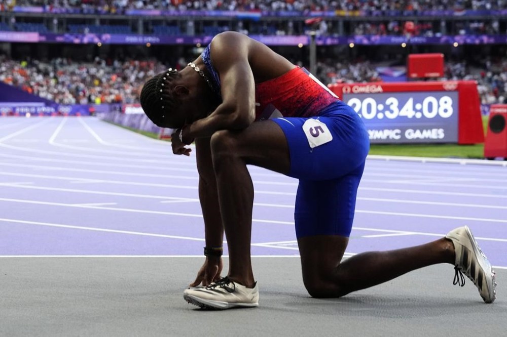 Noah Lyles, of the United States, reacts following the men's 200-meters final at the 2024 Summer Olympics, Thursday, Aug. 8, 2024, in Saint-Denis, France.(AP Photo/Petr David Josek)