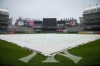 A tarp covers the field at Yankee Stadium before a baseball game between the New York Yankees and the Los Angeles Angels, Thursday, Aug. 8, 2024, in New York. (AP Photo/Bryan Woolston)