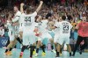 Germany players celebrate their victory after a semifinal handball match between Germany and Spain at the 2024 Summer Olympics, Friday, Aug. 9, 2024, in Villeneuve-d'Ascq, France. (AP Photo/Aaron Favila)