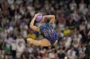 Baldassarri Milena, of Italy, performs ball exercise in the rhythmic gymnastics individuals all-round final at La Chapelle Arena at the 2024 Summer Olympics, Friday, Aug. 9, 2024, in Paris, France. (AP Photo/Charlie Riedel)